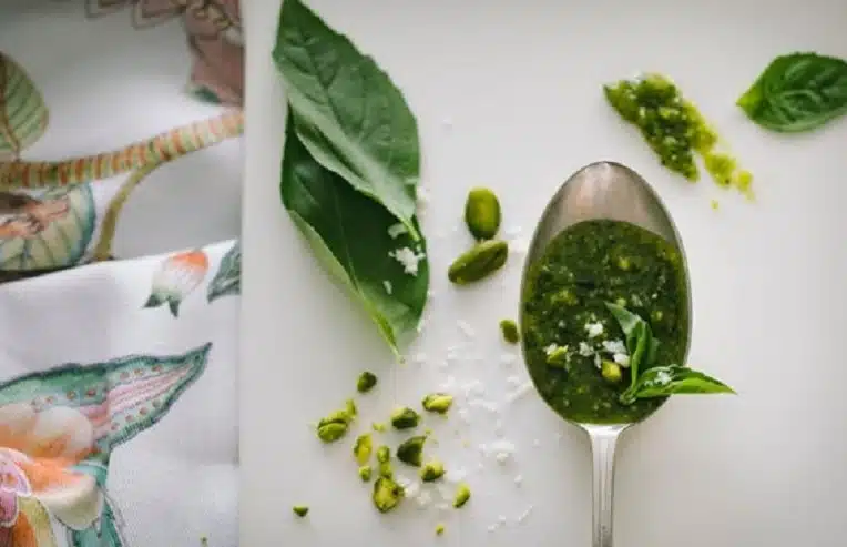 spoonful of basil pesto for summertime wellness recipe