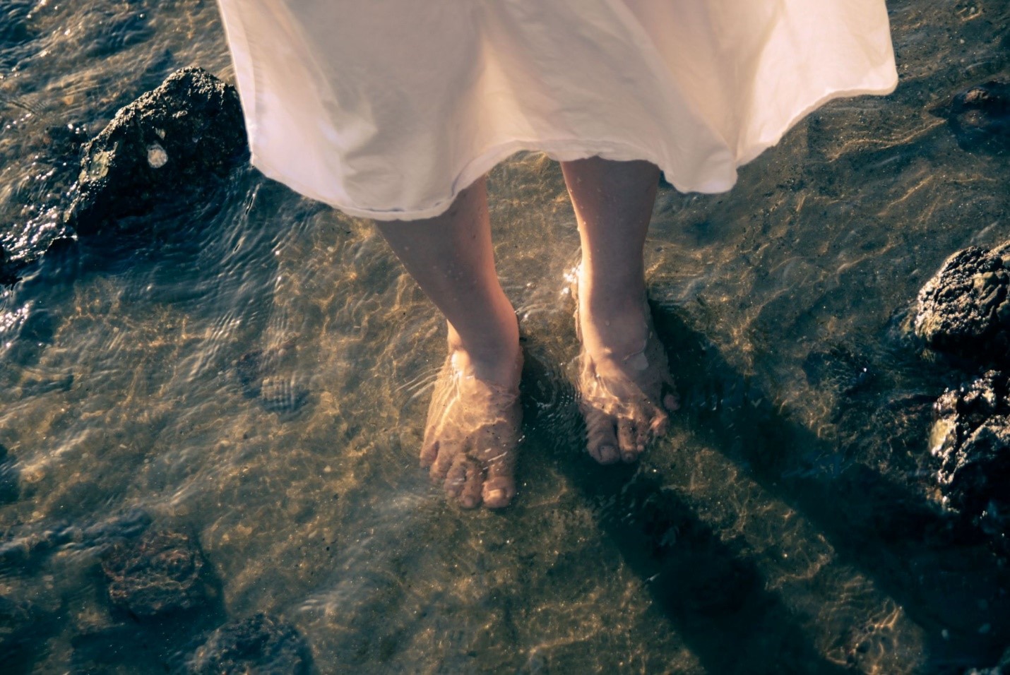 A woman standing in water to support progesterone naturally