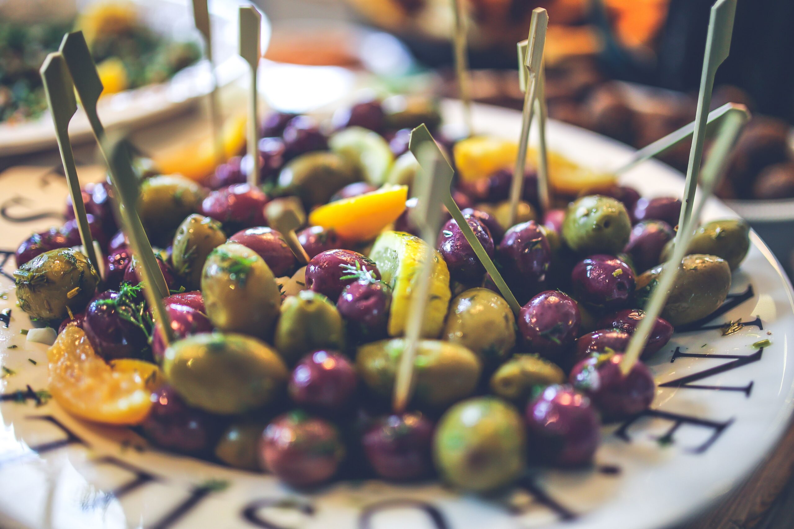 a plate of green and kalamata olives for eating for perimenopause